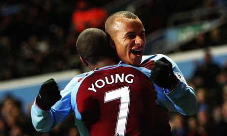 Gabriel Agbonlahor celebrates Aston Villa's fouth goal with scorer Ashley Young